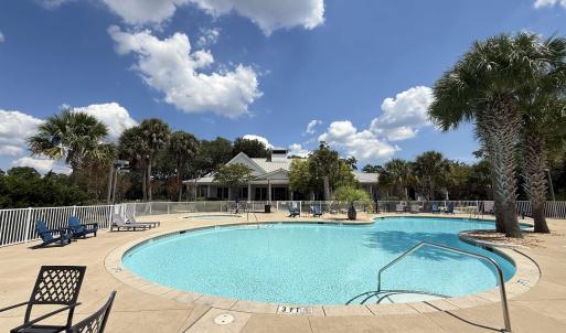 Community pool featuring a patio area