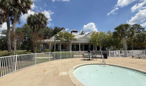 Community pool featuring a patio