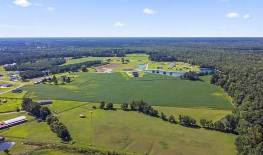 Aerial view of a nearby body of water and a heavil