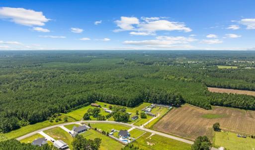 Aerial view of property and surrounding area with