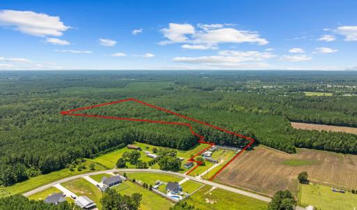 Aerial view of property and surrounding area with