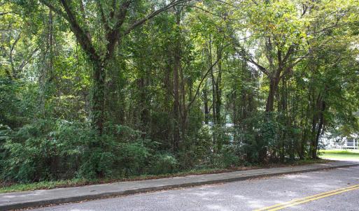 View of asphalt street featuring sidewalks