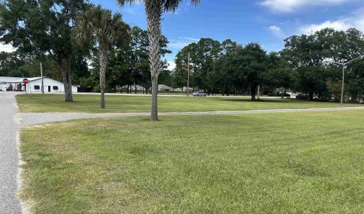 View of home's community featuring a lawn