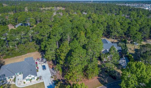 Aerial view of property and surrounding area with