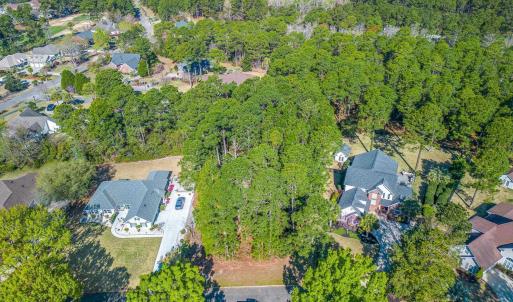 Aerial view of property and surrounding area with