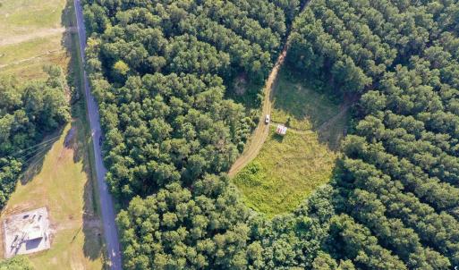 Aerial view of property and surrounding area with