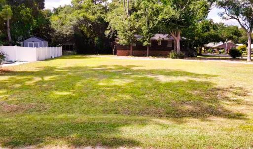 View of yard featuring view of wooded area