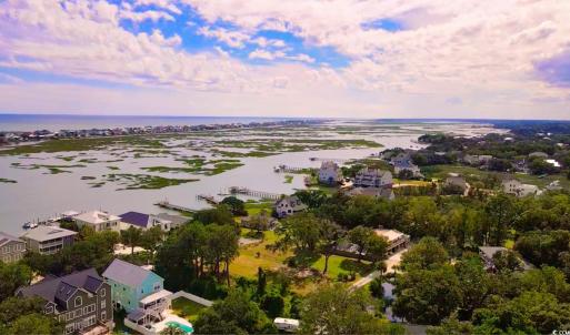 Aerial view of residential area with a large body