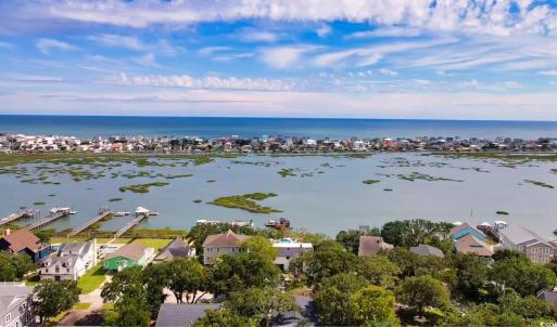 Aerial perspective of suburban area with a nearby