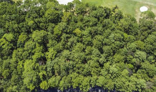 View of property location with a golf club