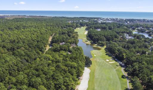 Aerial view of property's location with a large bo