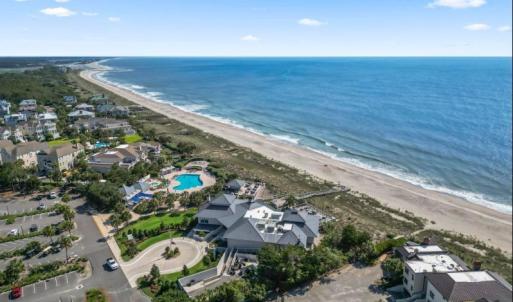 Aerial view of unending shoreline and a pool