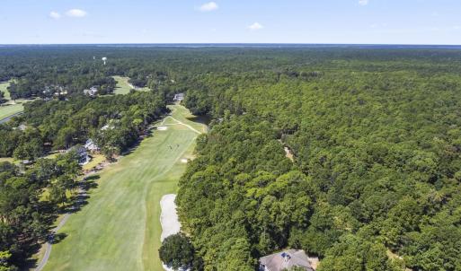 Aerial view of property and surrounding area with