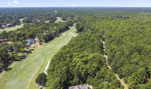 Aerial view of property and surrounding area with