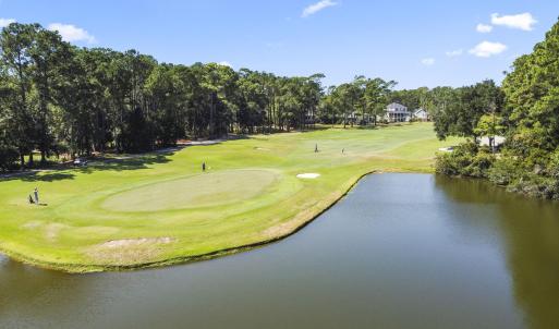 Surrounding community with view of golf course, vi