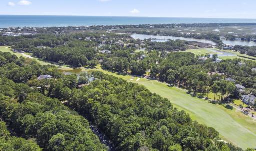 Aerial view of a large body of water and a golf co