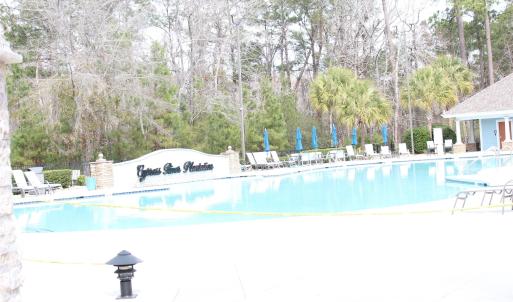 Community pool featuring a patio
