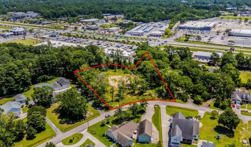 Aerial perspective of suburban area with a tree fi
