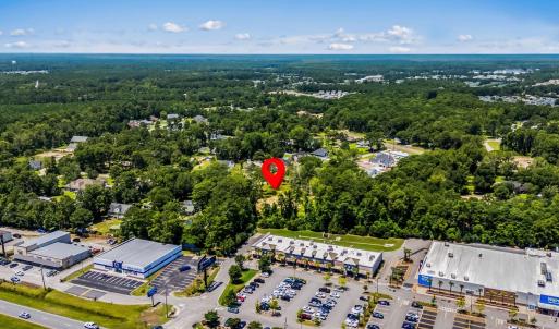 Aerial perspective of suburban area with a forest
