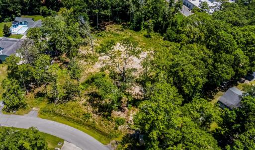Aerial view of property and surrounding area with