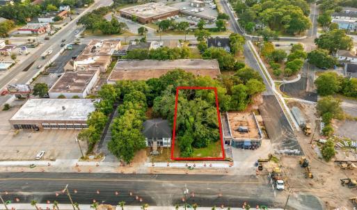 Aerial view of property and surrounding area with