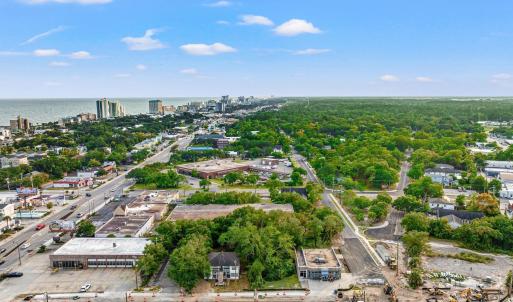View of property location with nearby urban area