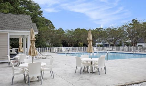 Community pool featuring a patio