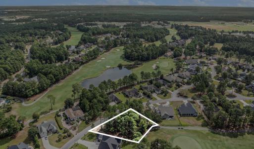 View of property location with a golf course;  pro