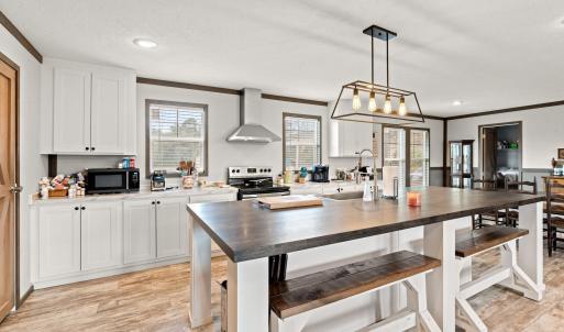 Kitchen with butcher block counters, healthy amoun