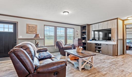 Living room with a textured ceiling, ornamental mo