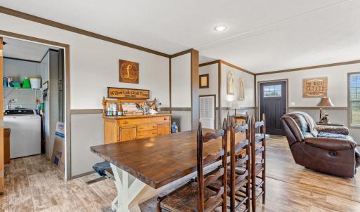 Dining space with washer / dryer, light wood-style
