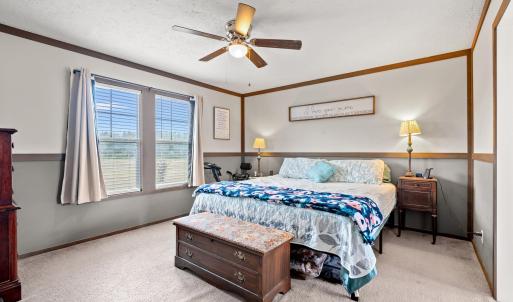 Bedroom featuring a textured ceiling, light colore