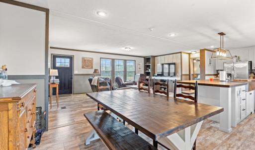 Dining space with crown molding, light wood-type f