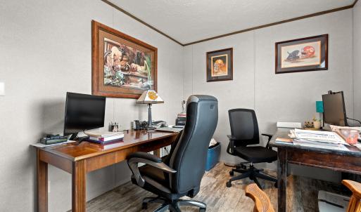 Office area featuring ornamental molding, wood fin