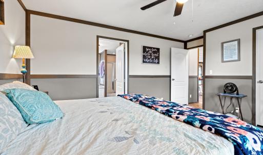 Bedroom featuring crown molding and ceiling fan