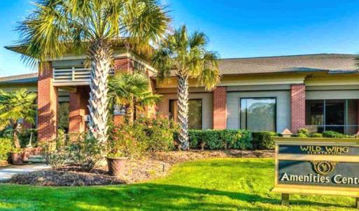 View of front of home featuring brick siding and a