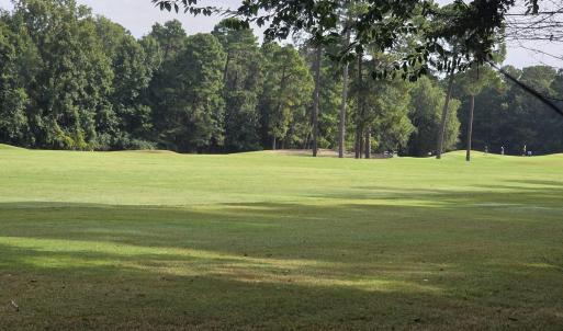 View of home's community with golf course view and