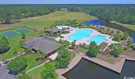 Drone / aerial view of a pool and a large body of