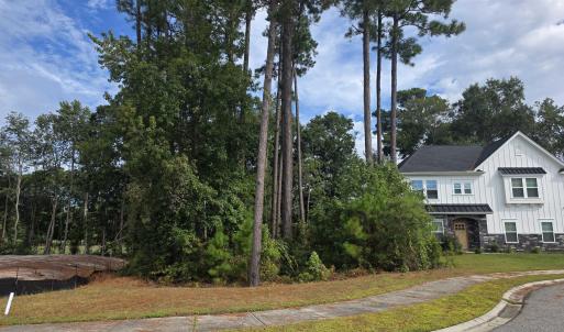 View of front of property with stone siding, board