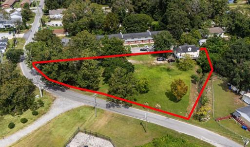 Aerial view of property and surrounding area with