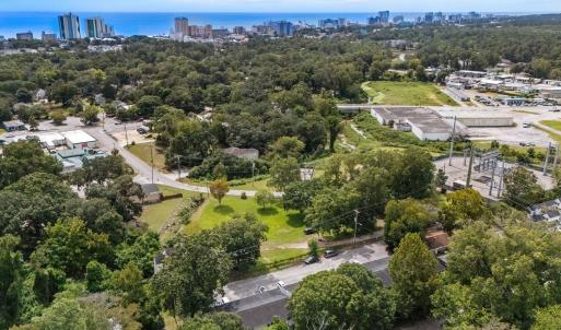 View of urban area featuring a tree filled landsca