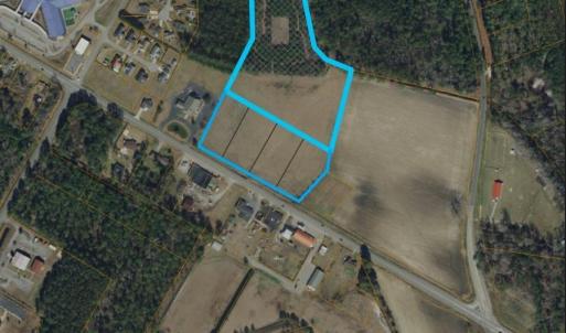 Aerial map of property and surrounding area featur