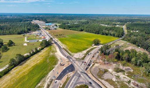 View of property location with a forest
