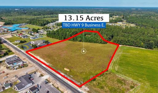 Aerial view of property and surrounding area with