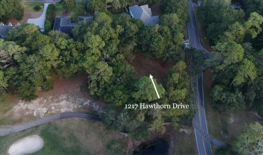 Aerial view of property and surrounding area with
