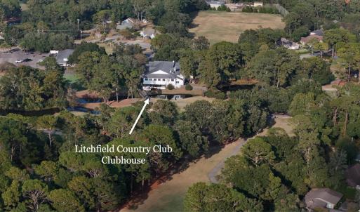 Aerial view of property and surrounding area with