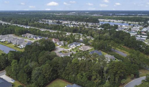 Aerial view of property and surrounding area with