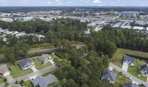 Aerial view of property and surrounding area with