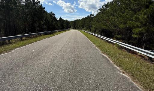 Paved Portion of Hidden River Road going over the
