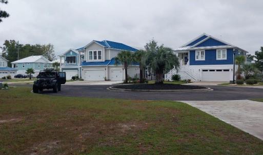 View of grassy yard with street views